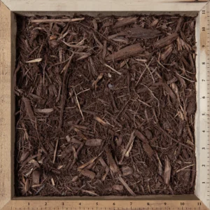 Brown mulch applied around flower beds and garden landscaping