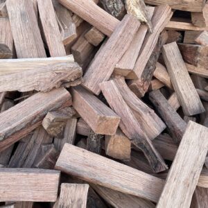 Stacked kiln-dried all Oak firewood logs ready to burn for fireplaces and fire pits