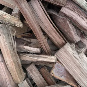 Stacked kiln-dried Hickory firewood logs ready to burn for fireplaces, fire pits, and BBQ