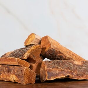 Stacked Cherry firewood logs seasoned and split for smoking, grilling, and heating