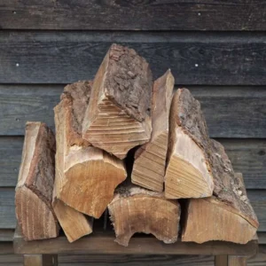 Stacked Maple firewood logs seasoned and split for fireplaces and fire pits