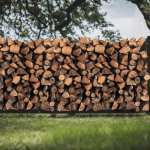 Stacked pecan firewood logs seasoned and split for heating and smoking